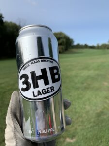 three heads beer on golf course