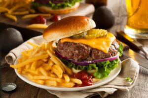 Cheeseburger and french fries on a plate